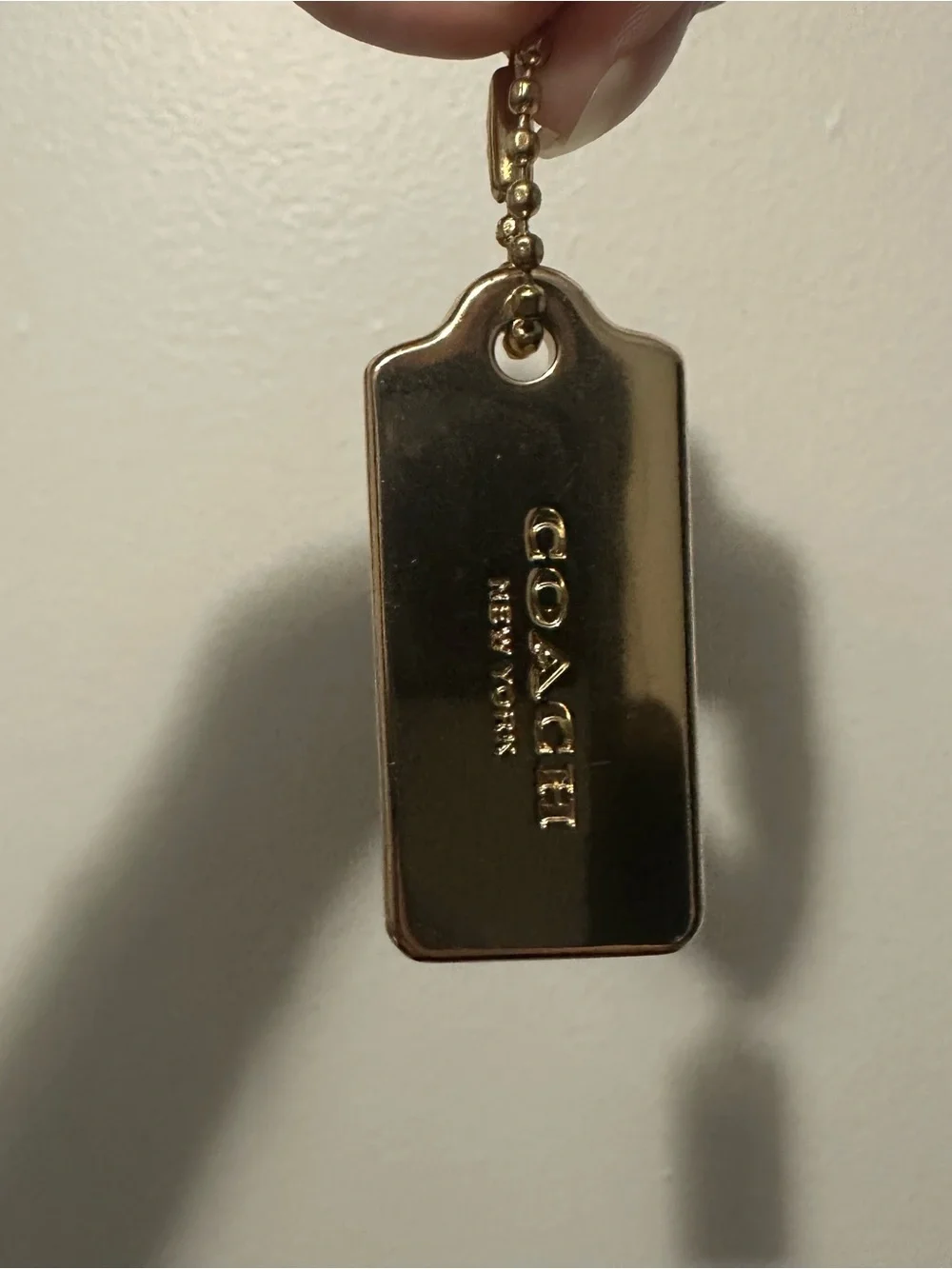 Coach gold metal